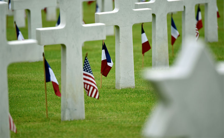 U.S. and French flags line the graves at the Suresnes American Cemetery in a Memorial Day ceremony, May 29, 2016. Photo by Senior Master Sgt. Brian Bahret, USAF